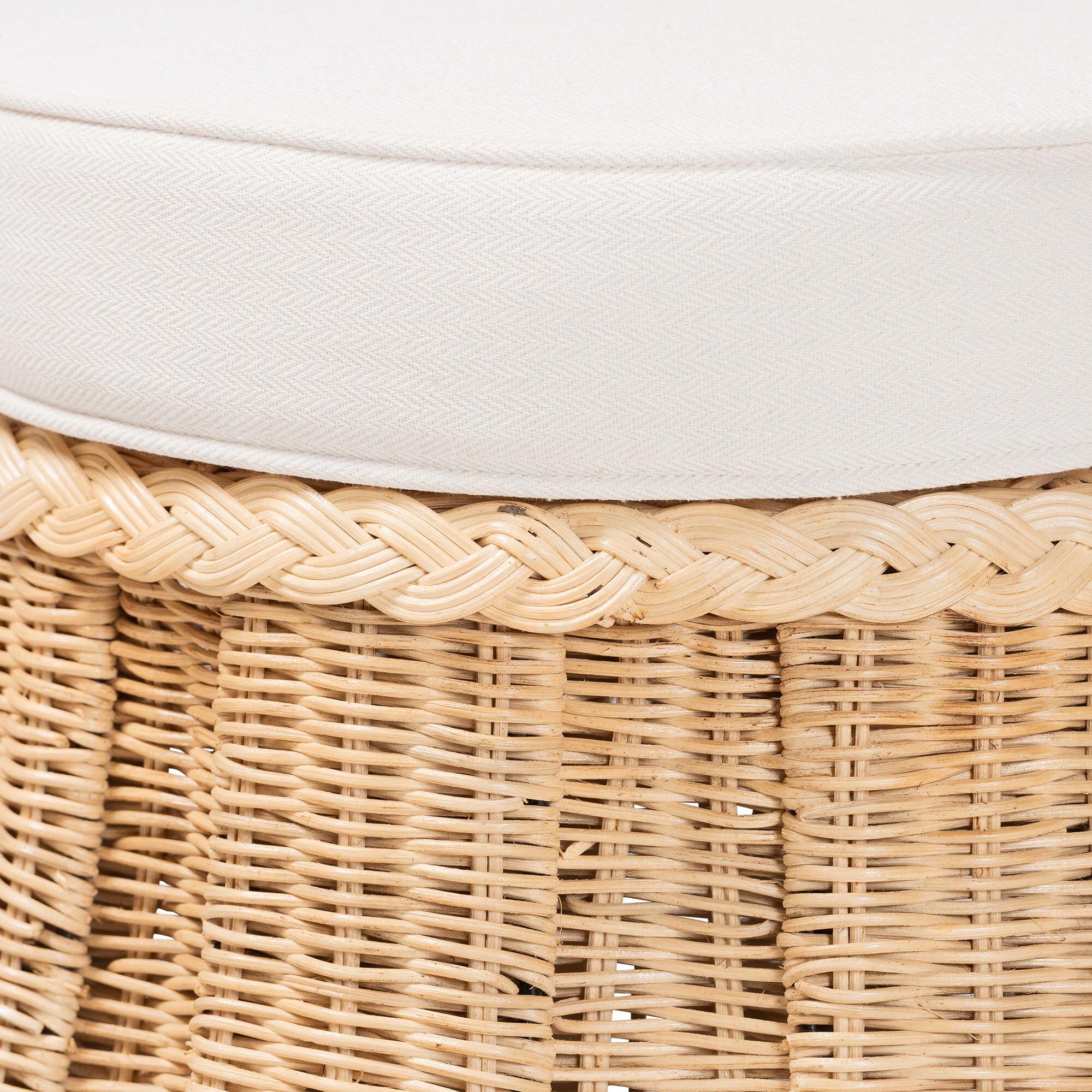 Close-up of the top edge of the rattan ottoman with white cushion