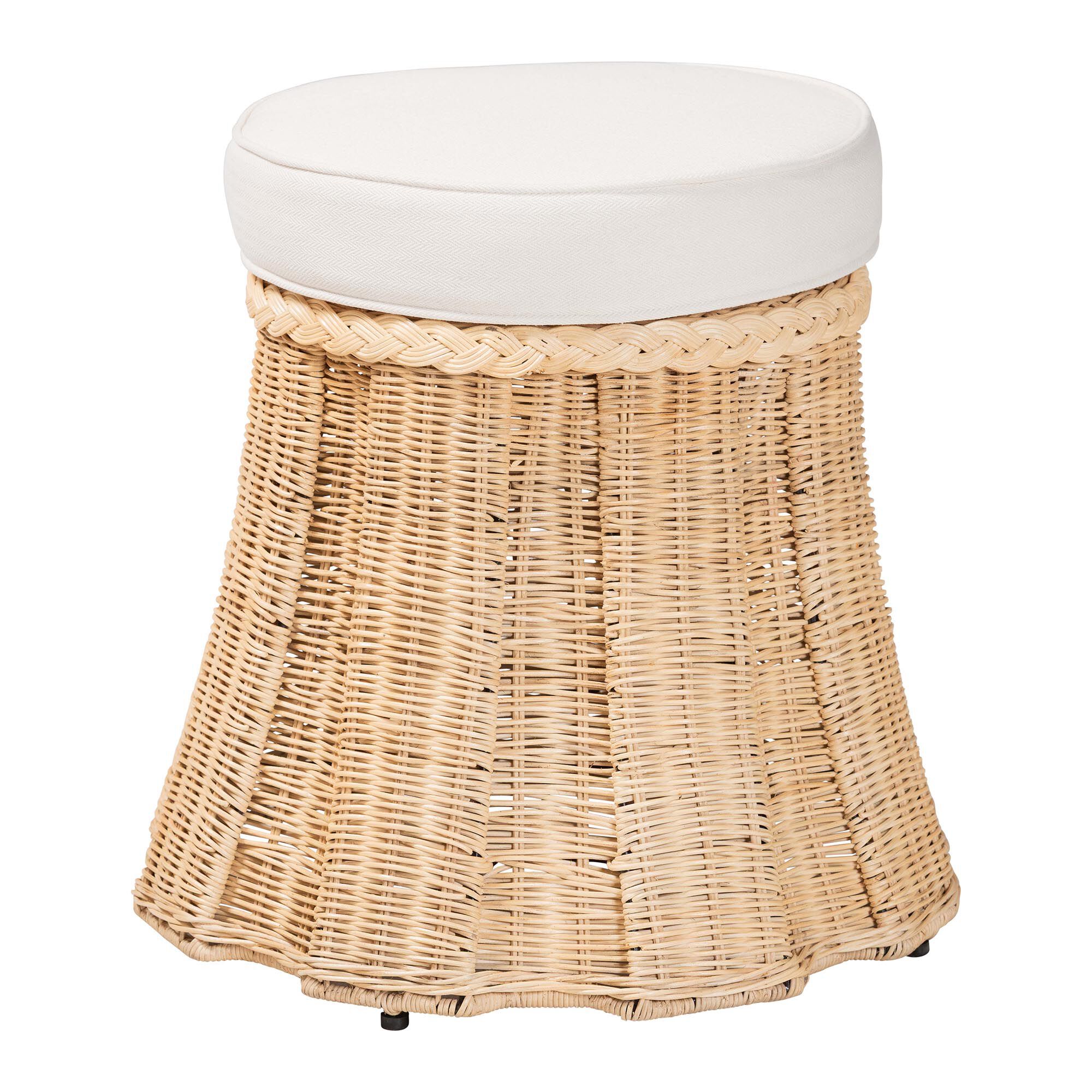 Round natural rattan ottoman with white cushion on a white background