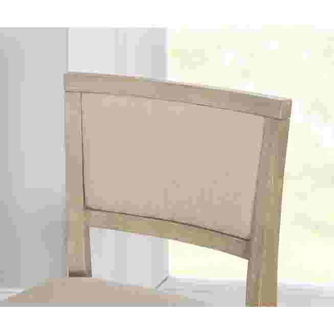 Close-up of the backrest of the grey wash folding bar stool