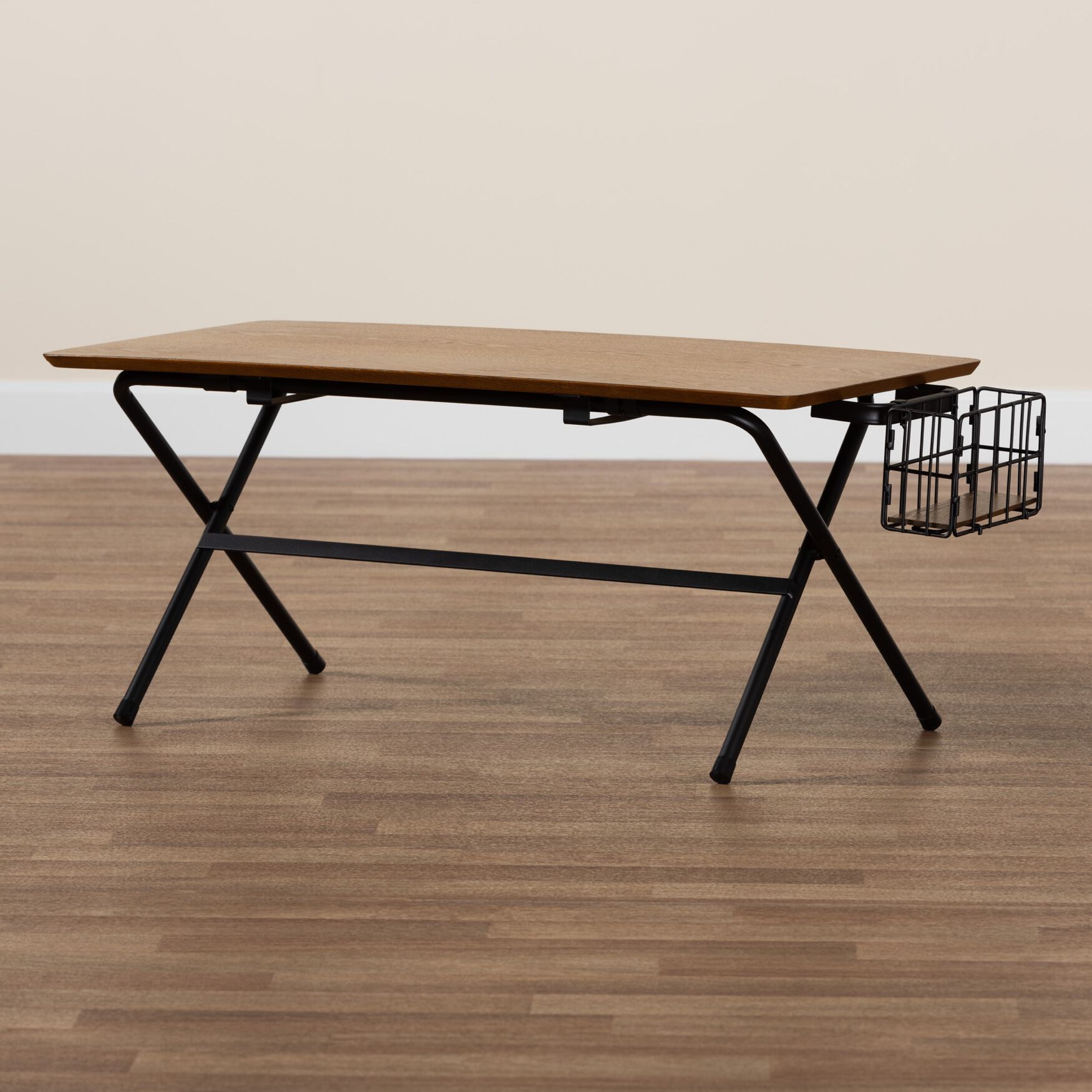 Low coffee table with natural wood top and black wire basket