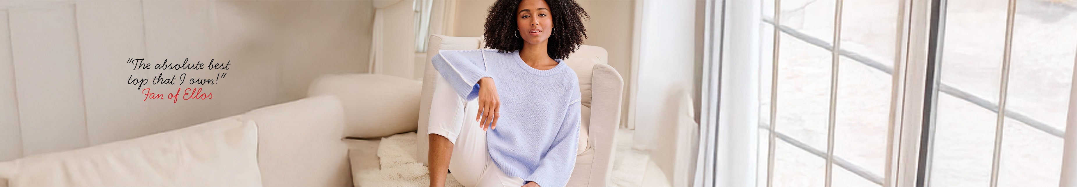 Woman wearing floral top and dark jeans