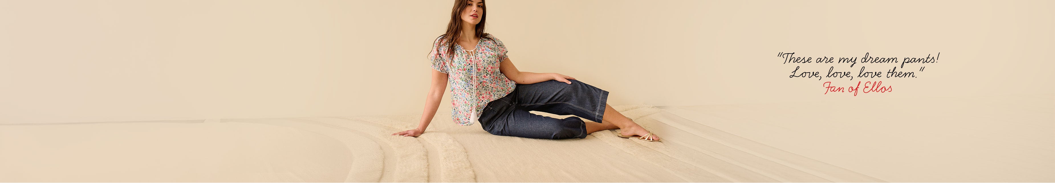 Woman wearing floral top and dark jeans