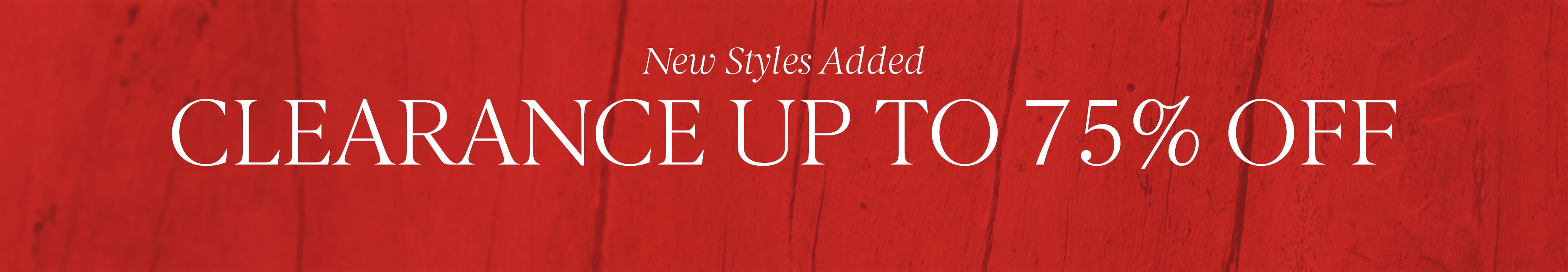 Woman wearing floral top and dark jeans